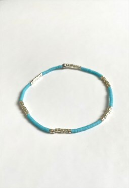 Blue and silver elastic beaded bracelet. Handmade item.
