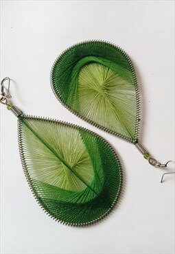 Green woven statement earrings