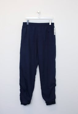 Vintage Reebok track pants in blue. Best fits M