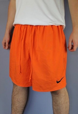 VINTAGE NIKE SHORTS IN ORANGE WITH EMBROIDERED LOGO AND DRAW