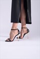 Indelicata high heeled sandals in black