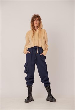 Sporty drop crotch trousers with eccentric pockets 