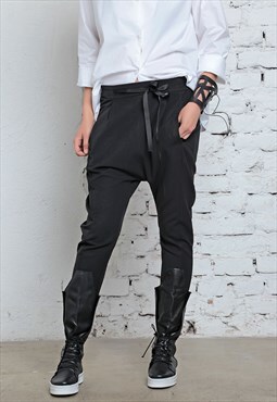 Slim fit drop-crotch pants with vertical welt pockets 
