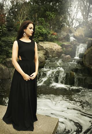 Simple evening dress with open sides and straight neck line