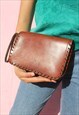 LEATHER CLUTCH BAG WITH FLORAL DETAIL