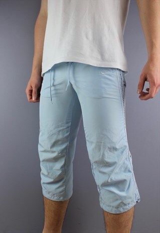 VINTAGE NIKE 3/4 LENGTH SHORTS IN BLUE WITH POCKETS AND EMBR