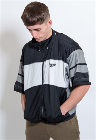 VINTAGE REEBOK BIG LOGO SHORT SLEEVED JACKET IN BLACK LARGE