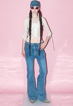 Vintage Y2K mid-rise bell bottom jeans in acid wash blue