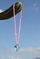 VINTAGE PINK BEADED NECKLACE WITH BLUE GLASS HEART PANDANT.