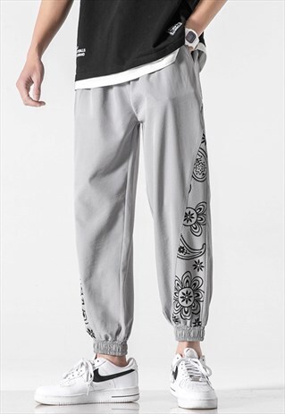 KALODIS FLOWER EMBROIDERED DRAWSTRING TROUSERS