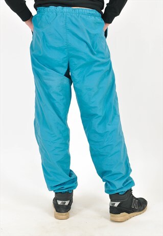 VINTAGE SHELL TRACK JOGGERS IN GREEN