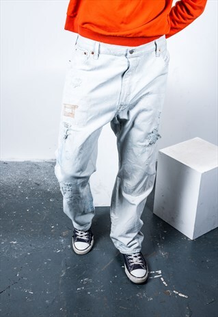 VINTAGE LEVI'S 501 JEANS IN LIGHT BLUE DENIM WITH RIPS