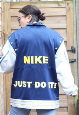 Vintage 1990s Nike embroidered jacket in blue and grey