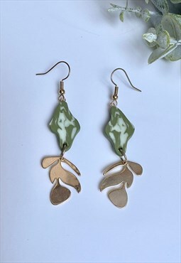 Green earrings with golden leaves detail 