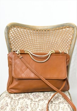 Vintage brown leather shoulder bag with metal handle