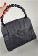 Vintage Christian Dior Malice black top handle bag.