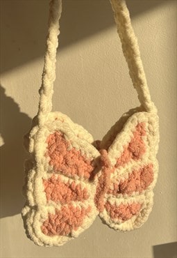 cream/sparkly pink butterfly bag