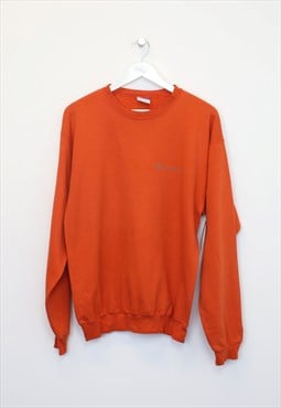 Vintage Champion sweatshirt in orange. Best fits M