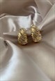 CRYSTAUX. Gold Crystal Croissant Huggie Earrings