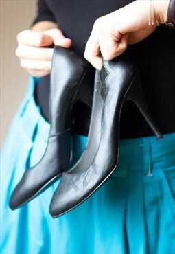 Black pointed high heel shoes