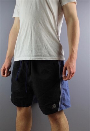 VINTAGE FILA SHORTS IN NAVY WITH POCKETS, RUBBER PATCH LOGO