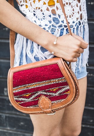 BROWN LEATHER AND CARPET SADDLE BAG