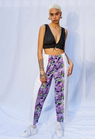 MULTI FLUORESCENT GRAPHIC PRINT TRACKSUIT BOTTOMS IN LILAC