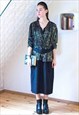 Black peplum belted dress with golden pattern top