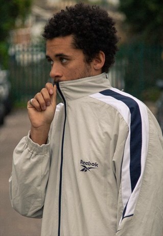 VINTAGE 90S REEBOK TRACKSUIT JACKET IN BEIGE, WHITE AND NAVY
