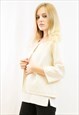 KNITTED SHORT CARDIGAN WITH THREE QUARTERS SLEEVES IN WHITE 
