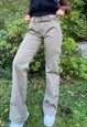 Khaki low-rise cargos with belt attached.
