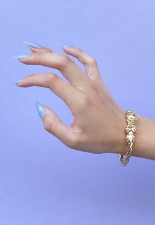TWISTED GOLD BRACELET WITH LION HEADS