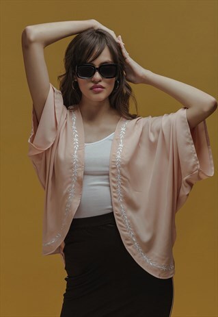 EMBROIDERED SHRUG IN PEACH