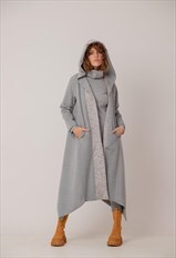 Asymmetric coat with large hood in loose silhouette 