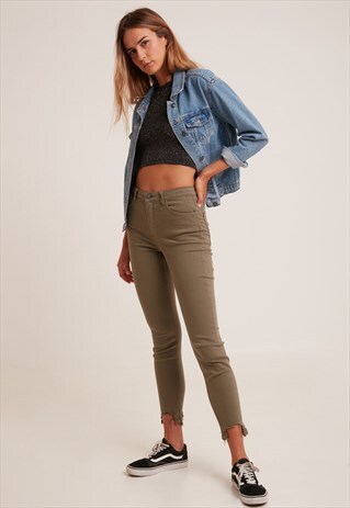 SUBDUED ARMY GREEN ASYMMETRIC SKINNY JEANS