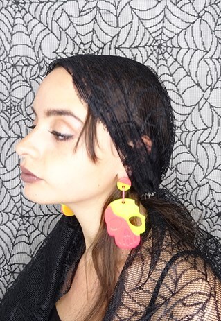 LARGE TWO-TONE PINK AND YELLOW SKULL EARRINGS.