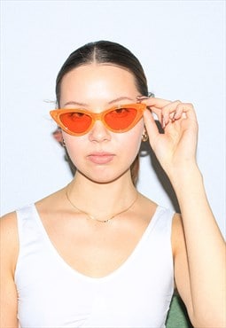 Vintage Y2K iconic cateye sunglasses in neon orange