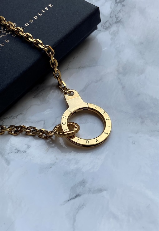 Authentic reworked Louis Vuitton small charm necklace.