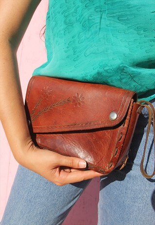 LEATHER CLUTCH BAG WITH FLORAL DETAIL