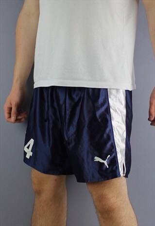 VINTAGE PUMA SHORTS IN NAVY WITH PRINT LOGO AND DRAWSTRINGS.