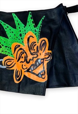 Black faux leather skirt with colorful print