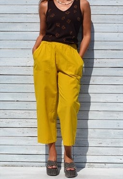 Mustard yellow organic cotton tapered baggy cropped pants.